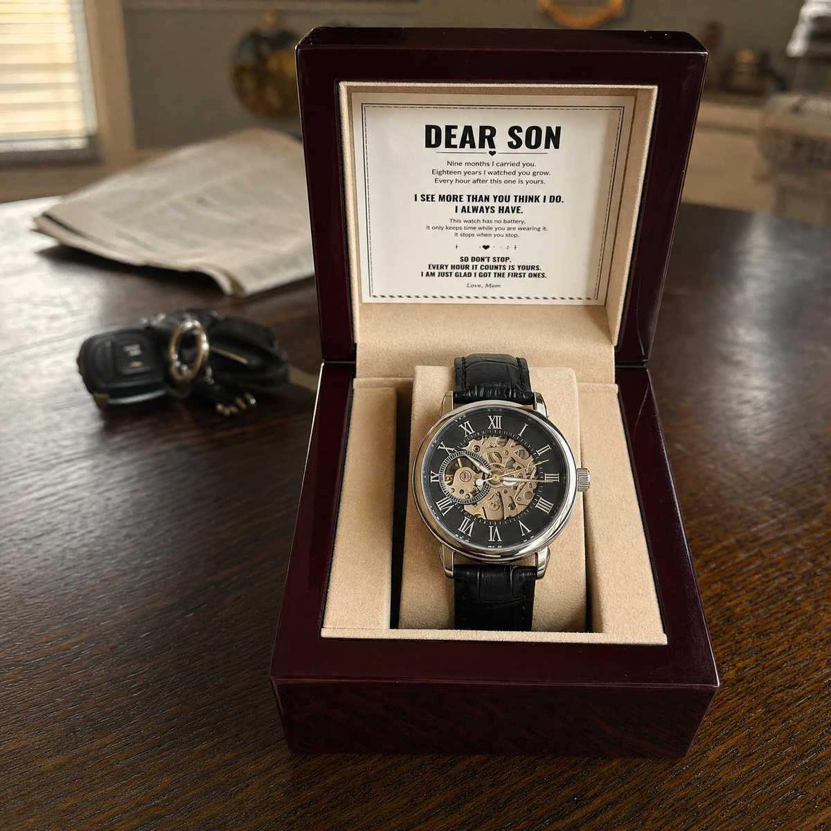 The open gift box with the printed To My Son letter set into the lid and the watch below it